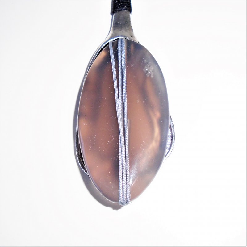 Hippie style long quartz pendant on double 19.25 inch cord. Stone is brown and gray in color.