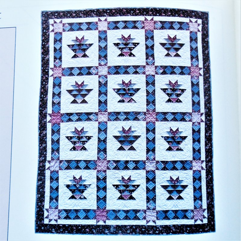 Flower Pot quilt pattern with templates. Gives sizes and information for making a 52.5 by 66.25 inch quilt.