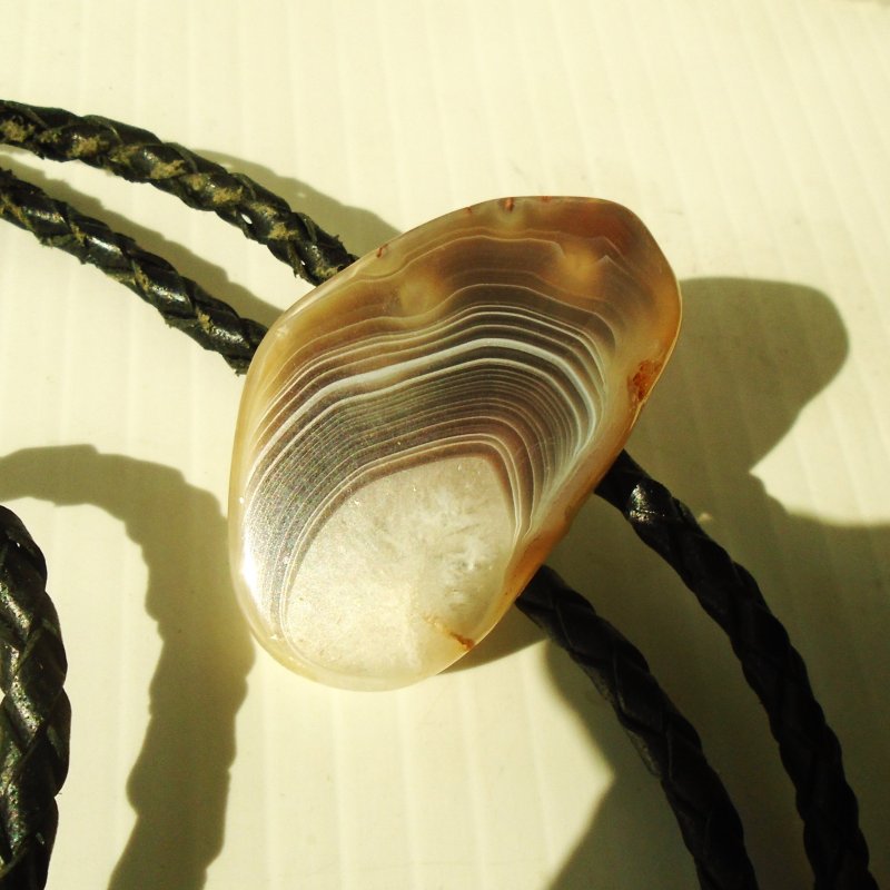 Black and gray polished agate stone bolo tie on 40.5 inch cord.