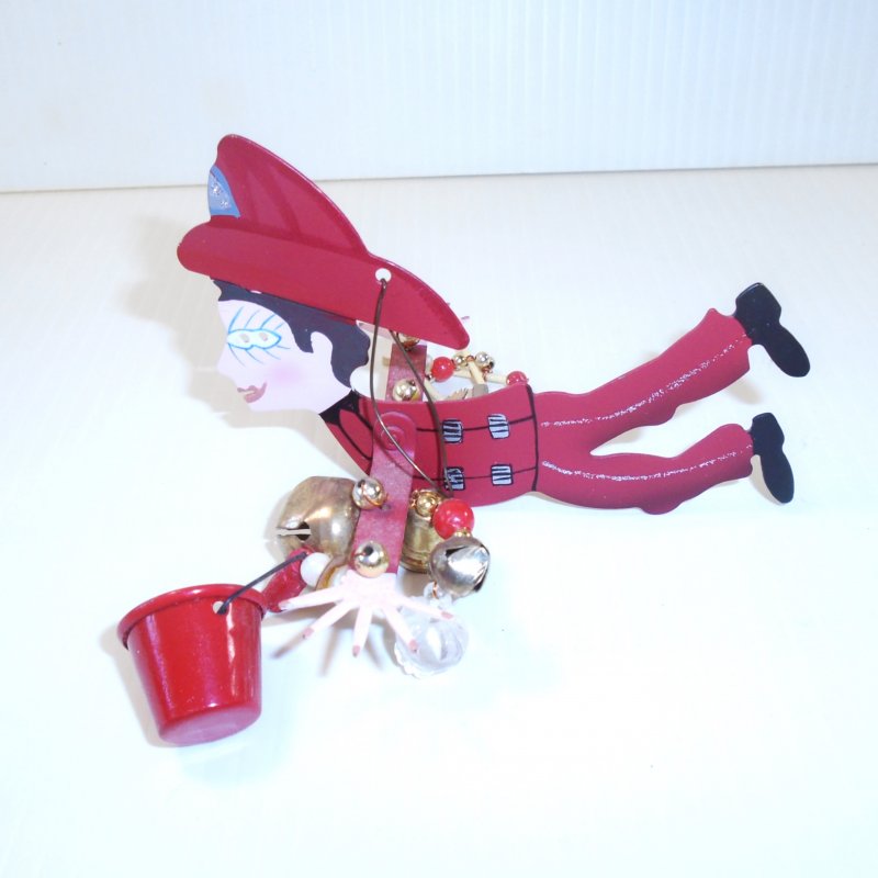 Karen Rossi Silvestri whimsical Christmas Fireman ornament. Can also be used year round as a mobile.