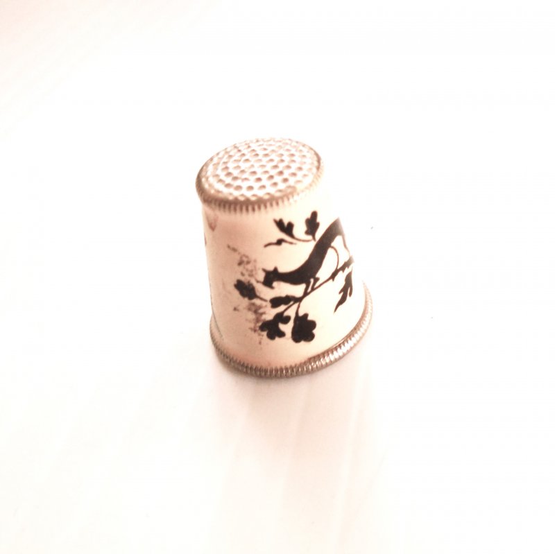 Vintage collectable thimble featuring a silhouetted cat in a tree. Made in Austria.