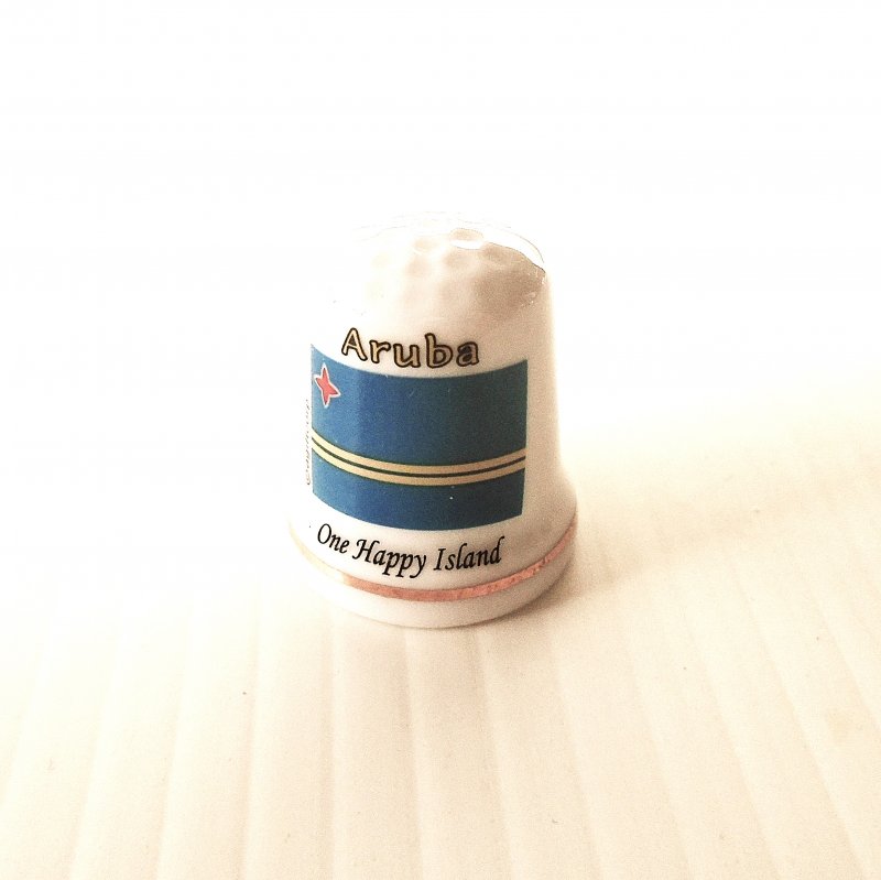 Vintage collectable thimble featuring the flag of Aruba, a Caribbean Island.