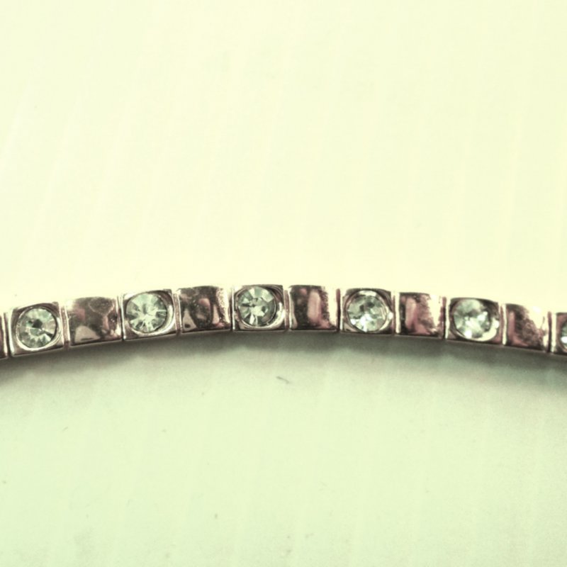 Gold tone 7.5 inch bracelet with 13 CZ stones. Possible gold fill. Estate find.