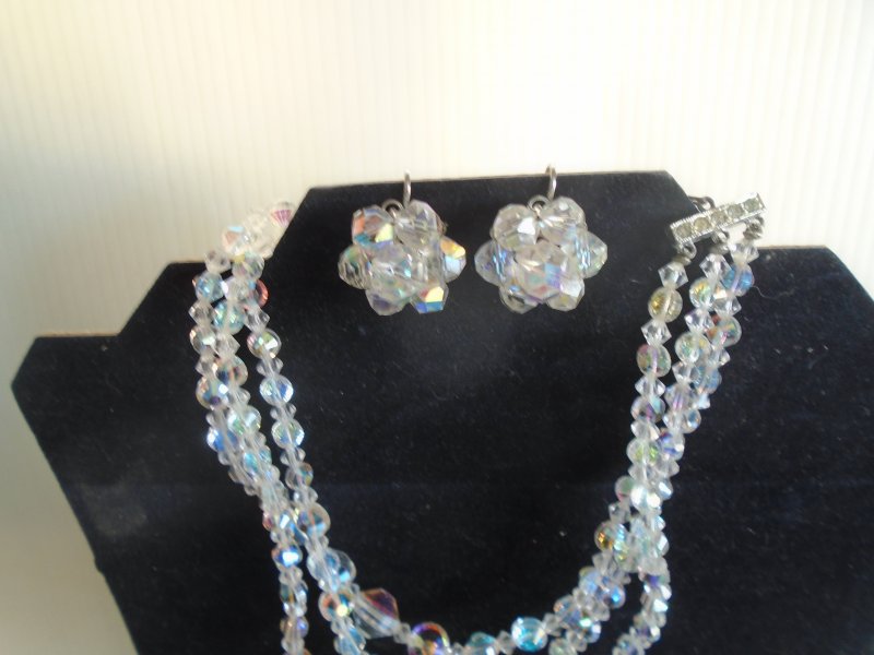 Laguna 3 strand Aurora Borealis necklace with matching earrings. Dates to 1955 to 1960.