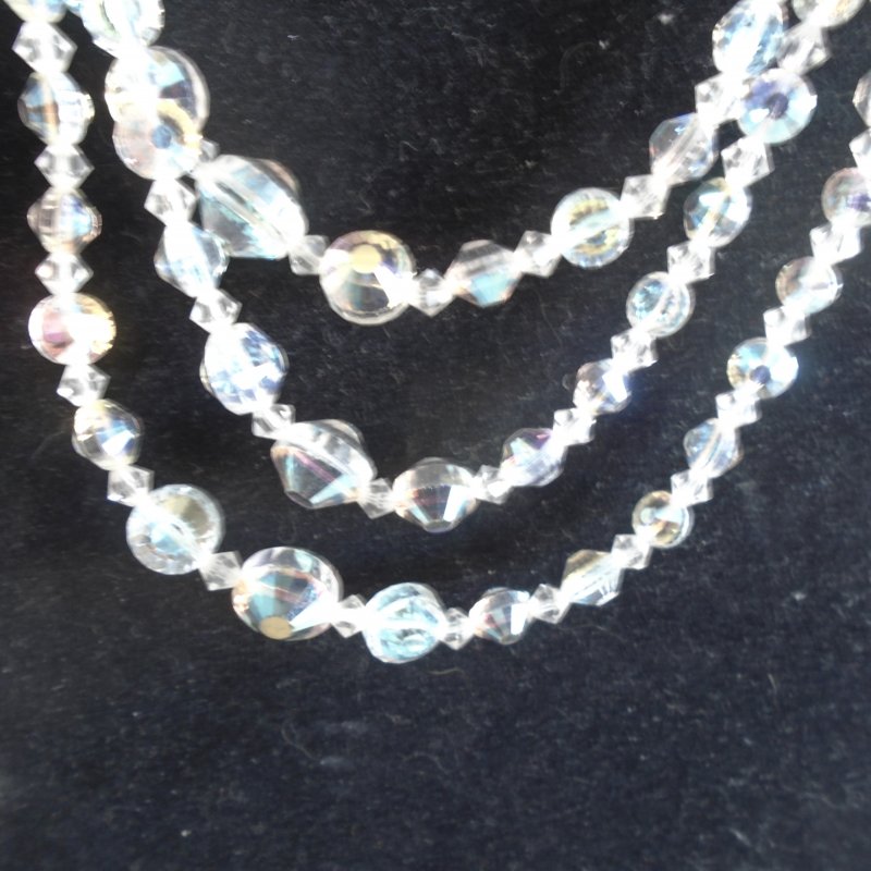 Laguna 3 strand Aurora Borealis necklace with matching earrings. Dates to 1955 to 1960.