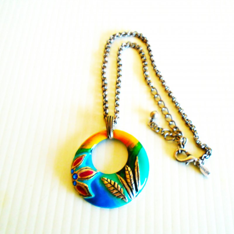 Chico’s multi color enamel disc necklace with flower theme and green rhinestones.