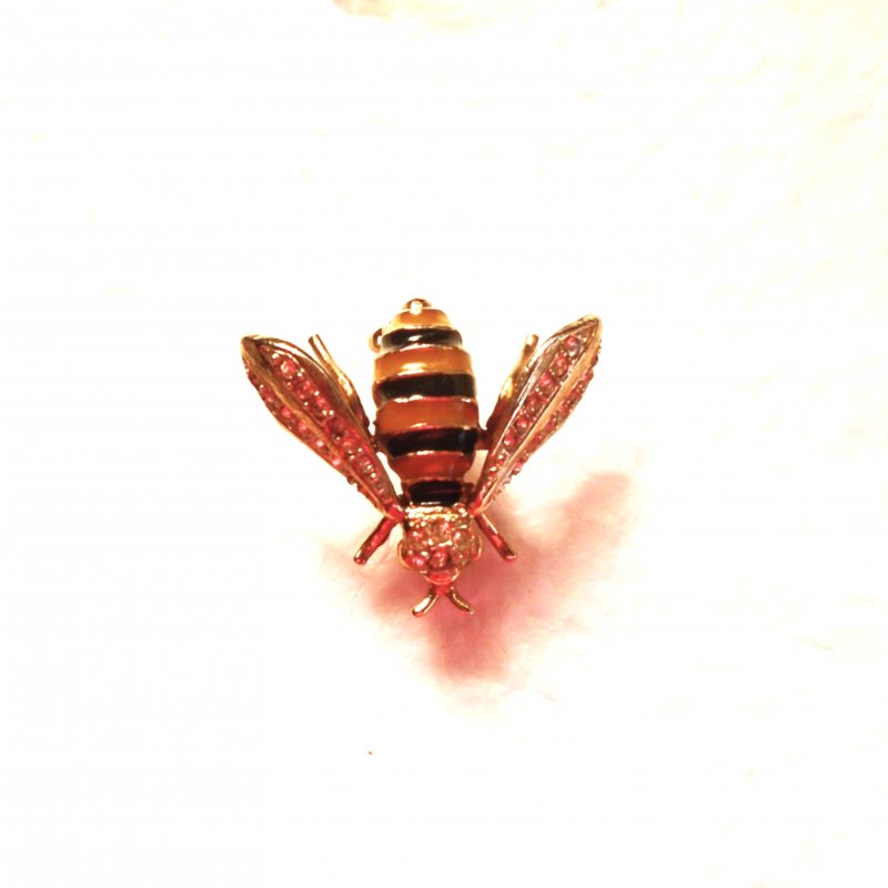 Honey Bee brooch pin. One inch in size. Yellow and black striped body. Lifelike appearance.