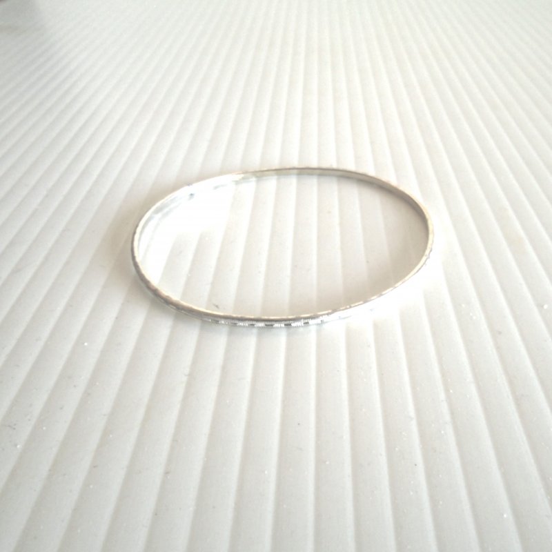 Stainless Steel bangle bracelet, stated to be mid century. Marked “Germany”. 2.75 inch opening.