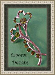 Silver Tone Flower Design Brooch With Green Crystals