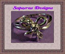 Silver Tone Bow Design Ring Size 5.5 With Clear Crystals