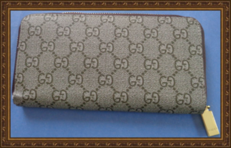 Image 1 of  Brown Long Zippy Leather Wallet With Snake Design Gold Tone Finish