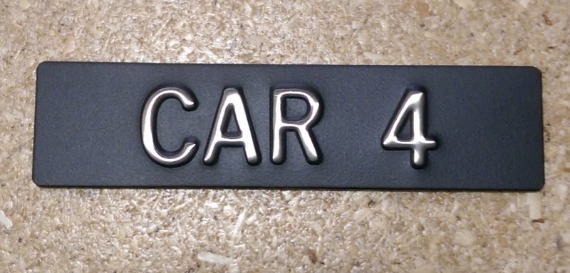 Image 0 of CAR14 Elevator Identification Plate 1 x 4 Black Background/Stainless Character