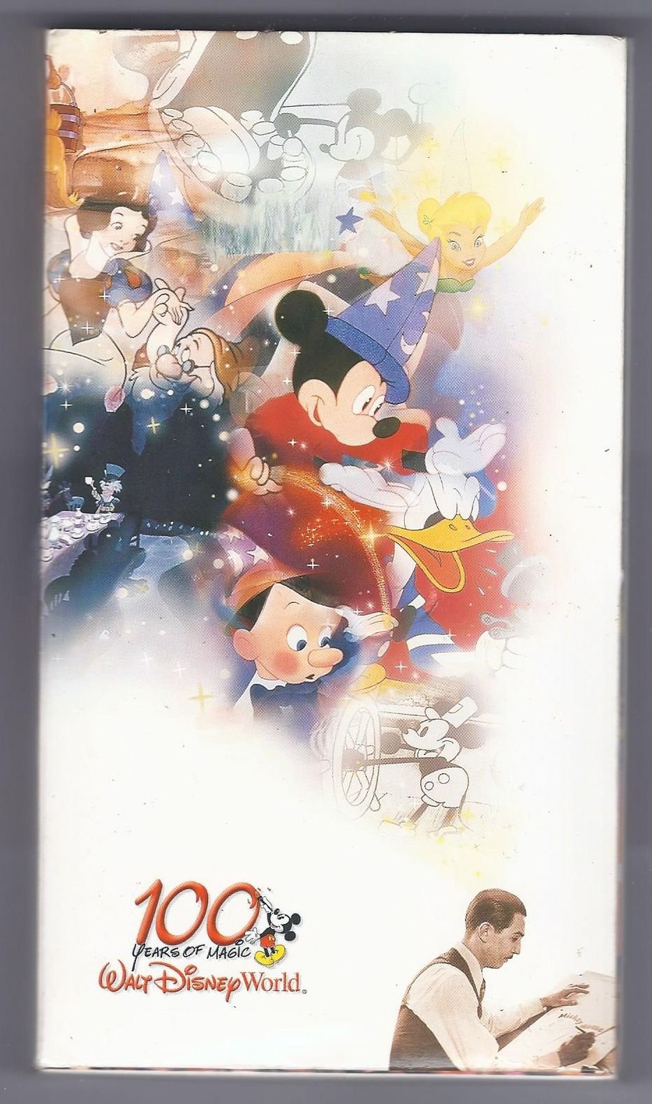 Front cover cardboard slipcover of the 2001 Walt Disney World 100 Years of Magic VHS tape showing Sorcerer Mickey Mouse casting magic over Pinocchio and Snow White.