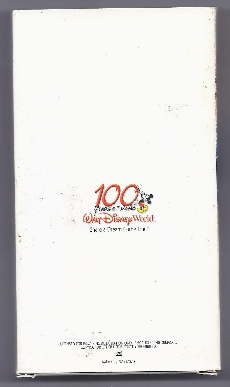 Clean white back cover of the Walt Disney World 100 Years of Magic VHS slipcover showing the official red 100 logo, tagline, and catalog number NA717070.
