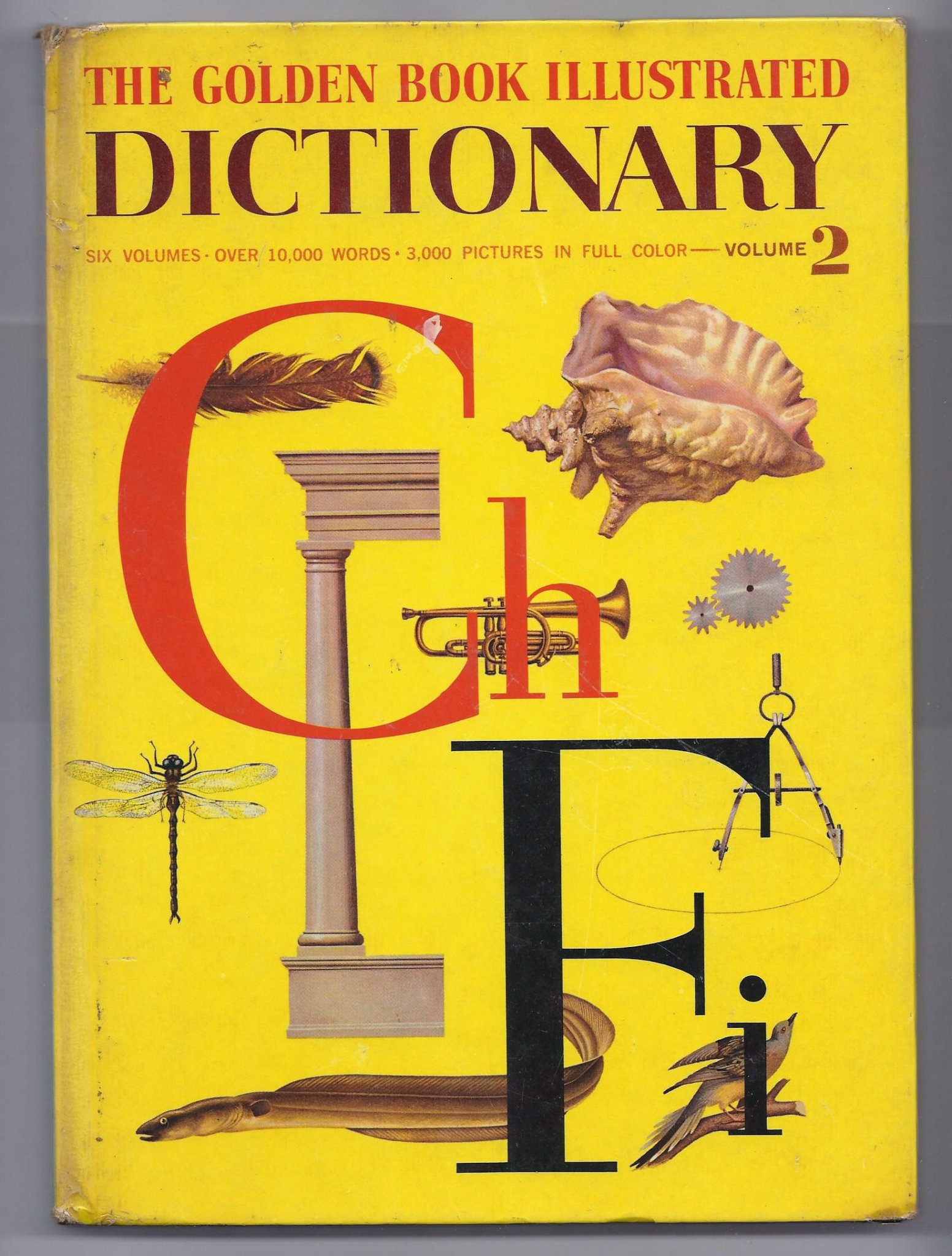 Front cover of 1961 The Golden Book Illustrated Dictionary Volume 2 featuring large letters Cl and Fi over a yellow background with educational drawings
