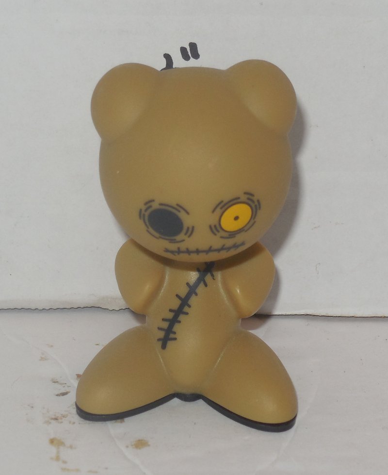 tiny tan figure
