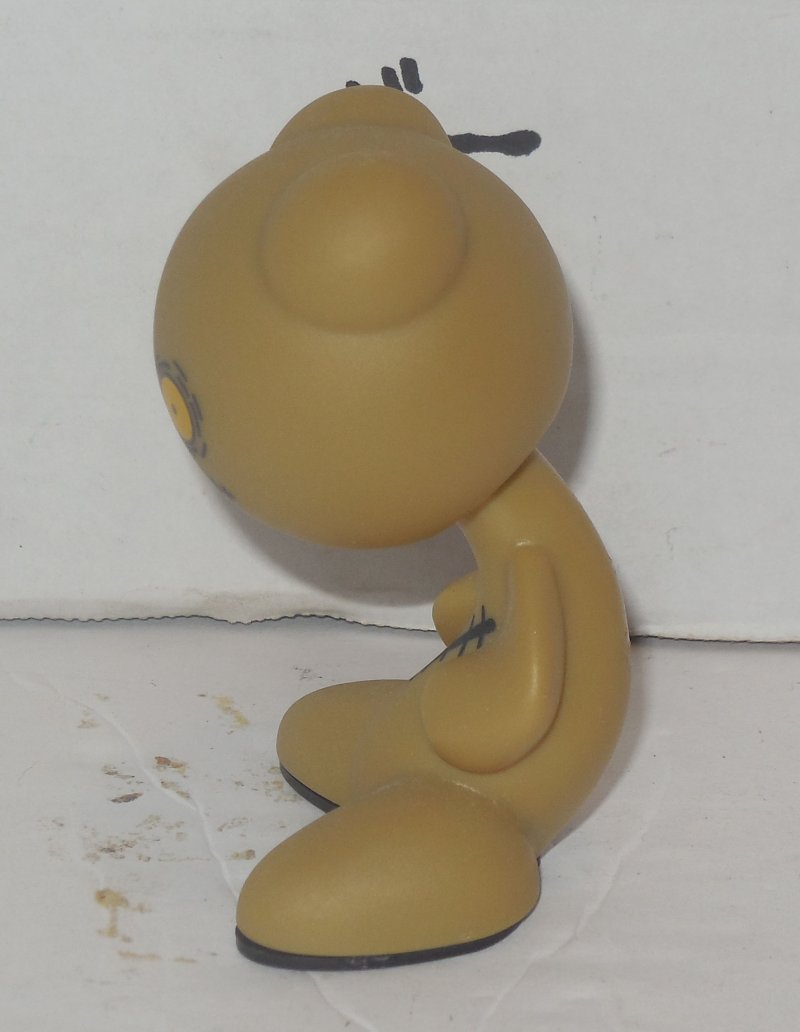 tiny tan figure