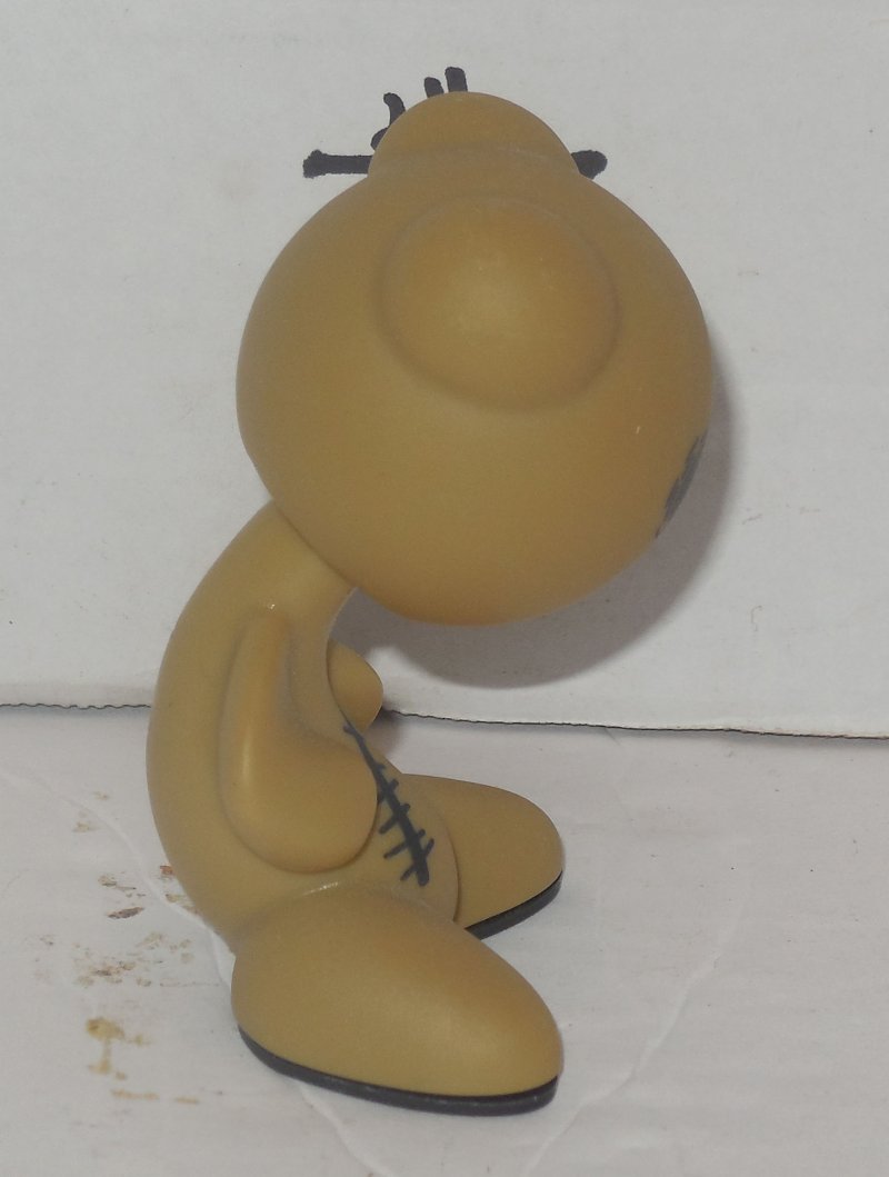 tiny tan figure