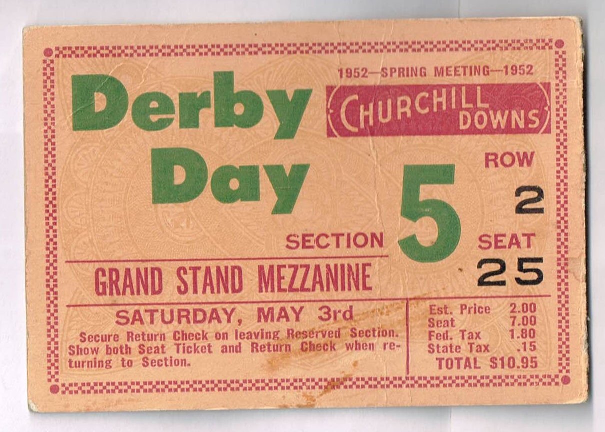 Front face of a pink 1952 Kentucky Derby Grand Stand Mezzanine ticket stub with bold green text for Derby Day and a dark red border