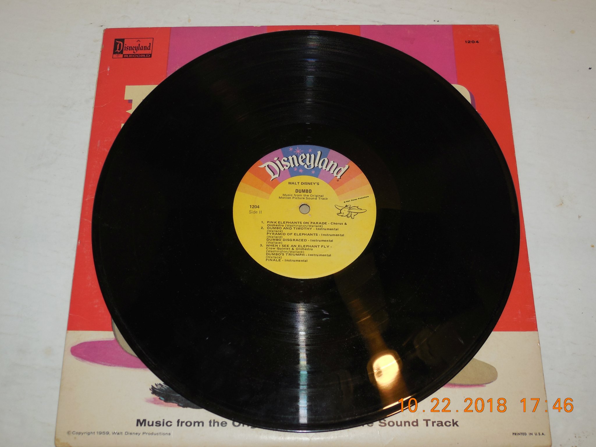 Side 2 of the black vinyl record disc showing the yellow Disneyland High Fidelity label for Walt Disney's Dumbo DQ-1204