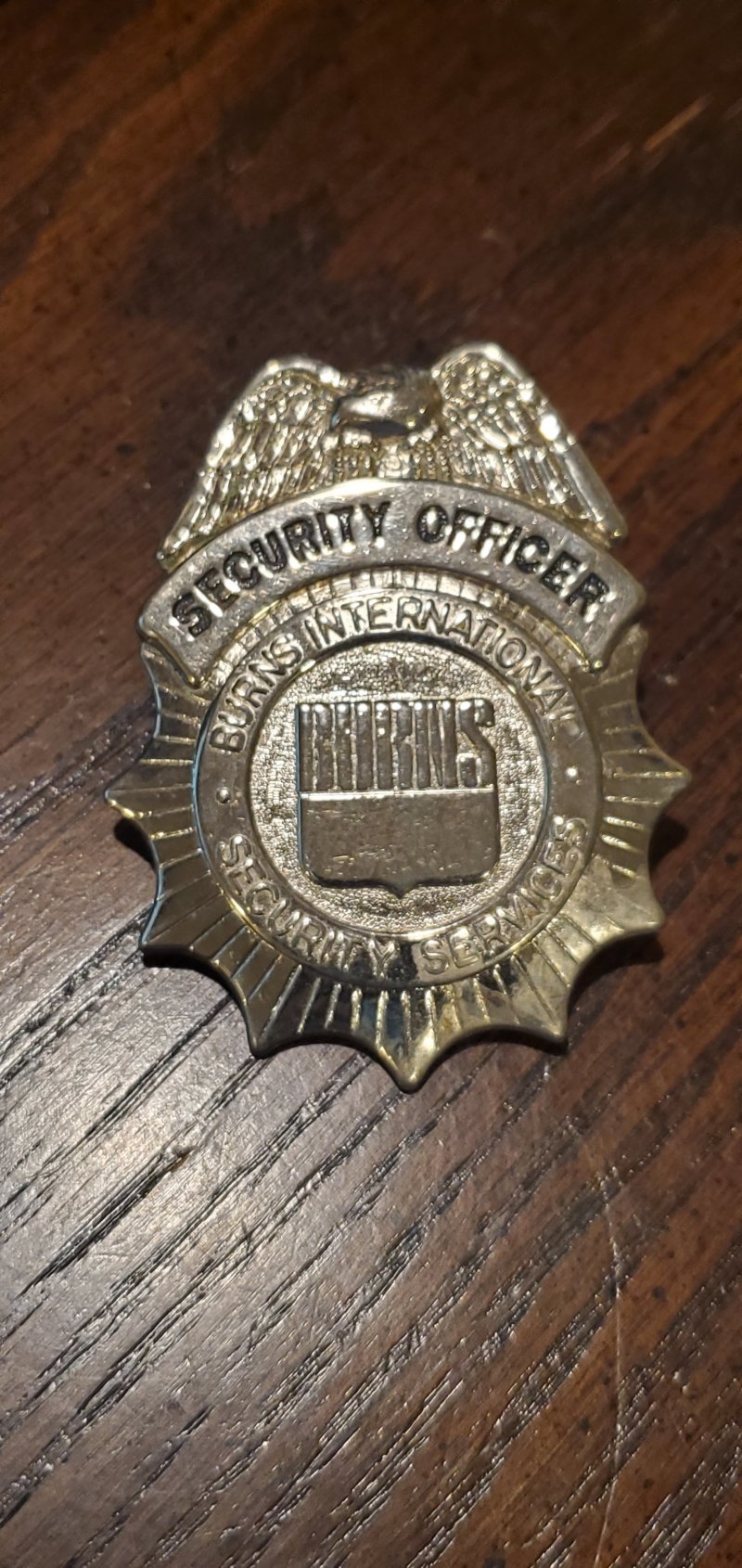 Image 0 of BURNS INT SECURITY SERVICES HAT BADGE 
