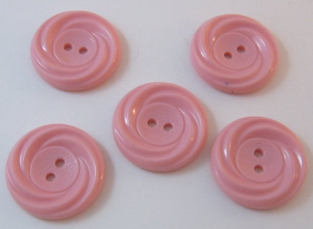 Pink plastic button