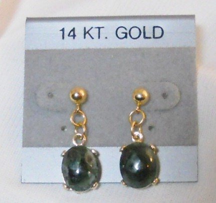 Earrings in 14 kt. gold settings.