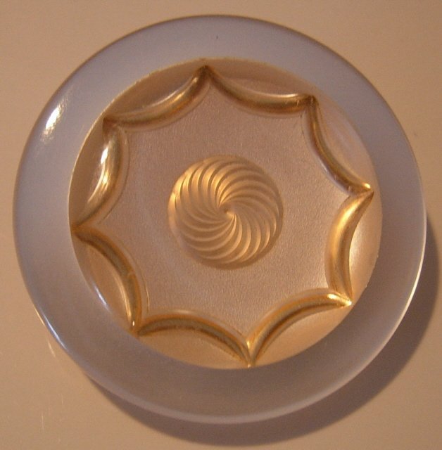 Very nice design under plastic button.