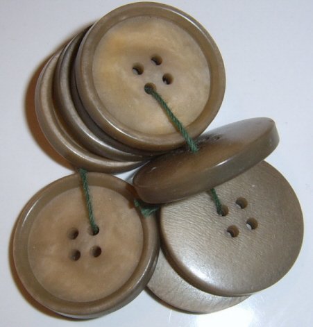 Lot of 8 Tan Plastic buttons 