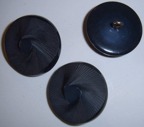 Navy blue carved swirl button